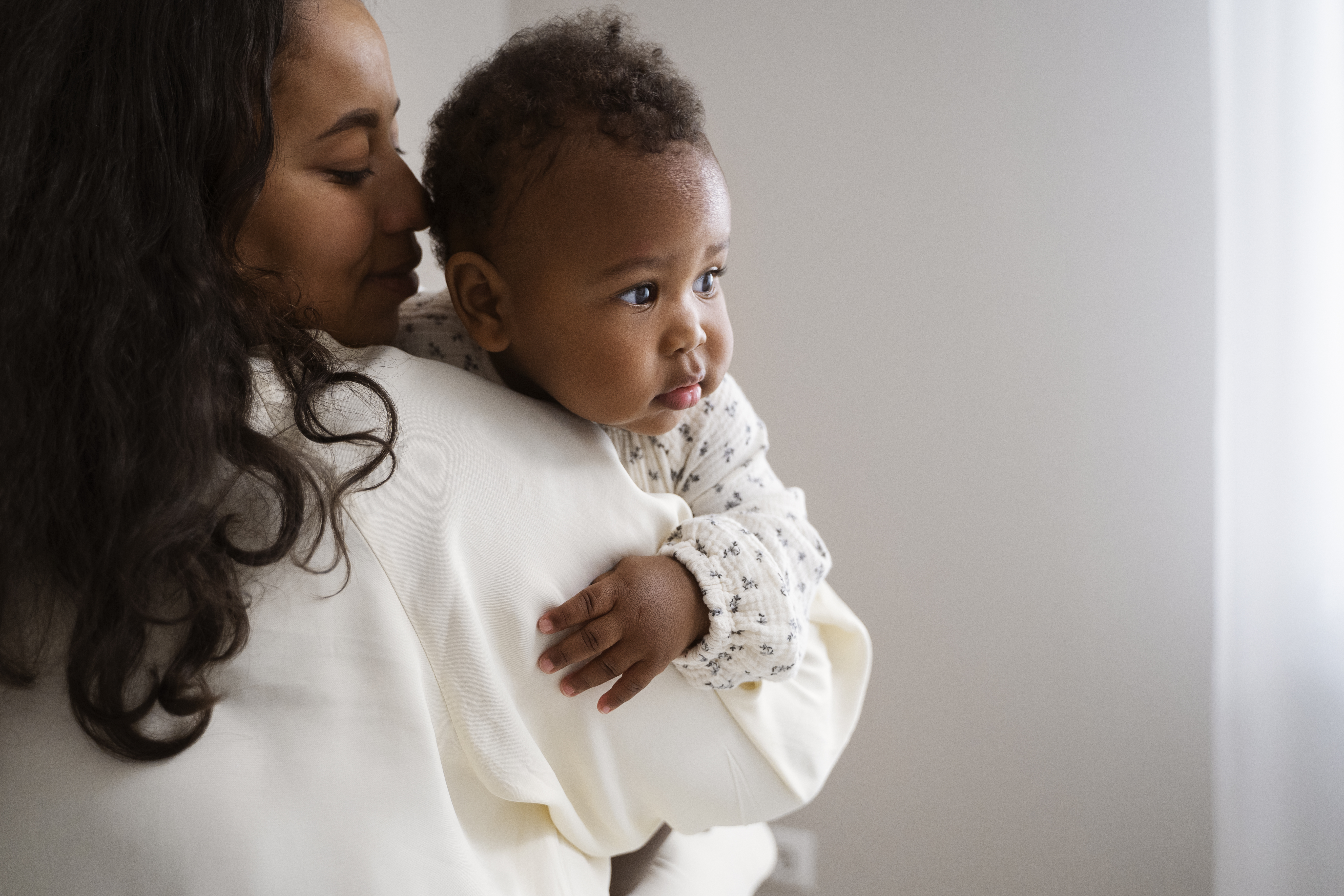 Adorable  baby with chubby cheeks demonstrating the cute aggression phenomenon